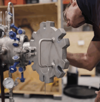 Transcend 2025-10-31 at 12.41.43 PM Engineer assembling machined metal components for separation technology