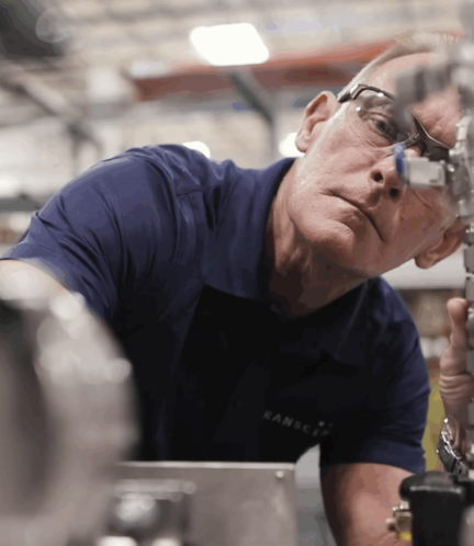 Engineer assembling or calibrating separations technology components. {{brizy_dc_image_alt imageSrc=